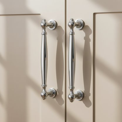Chrome handles on greige cabinet doors